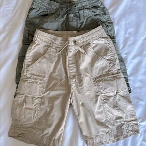 Two GapKids Medium cargo shorts with tie, khaki and dark green.